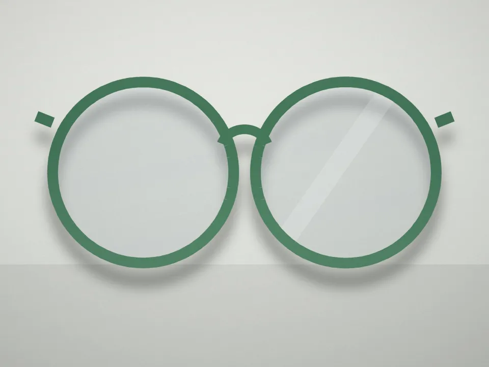 Monture ronde acétate souple vert posée sur un présentoir clair (modèle d'exemple)