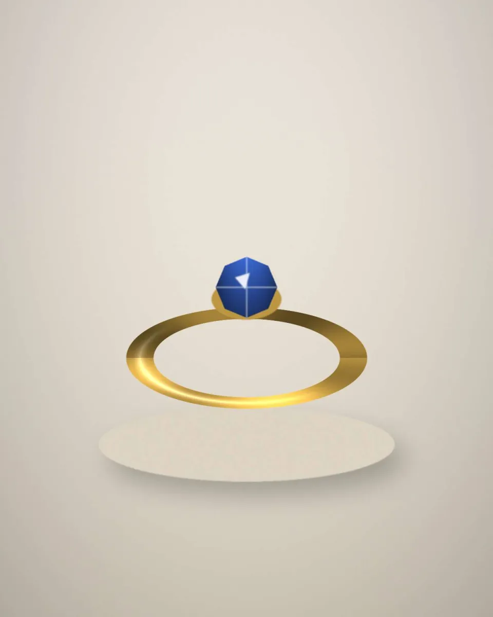 Bague en or jaune sertie d’un saphir bleu ovale