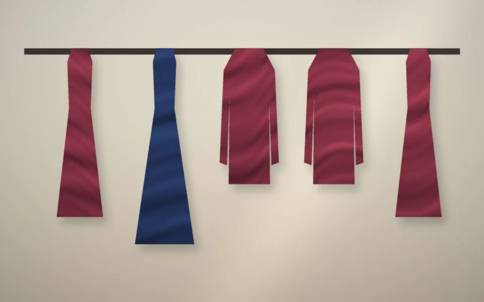 Portant de l’atelier avec robes et vestes en cours de retouche