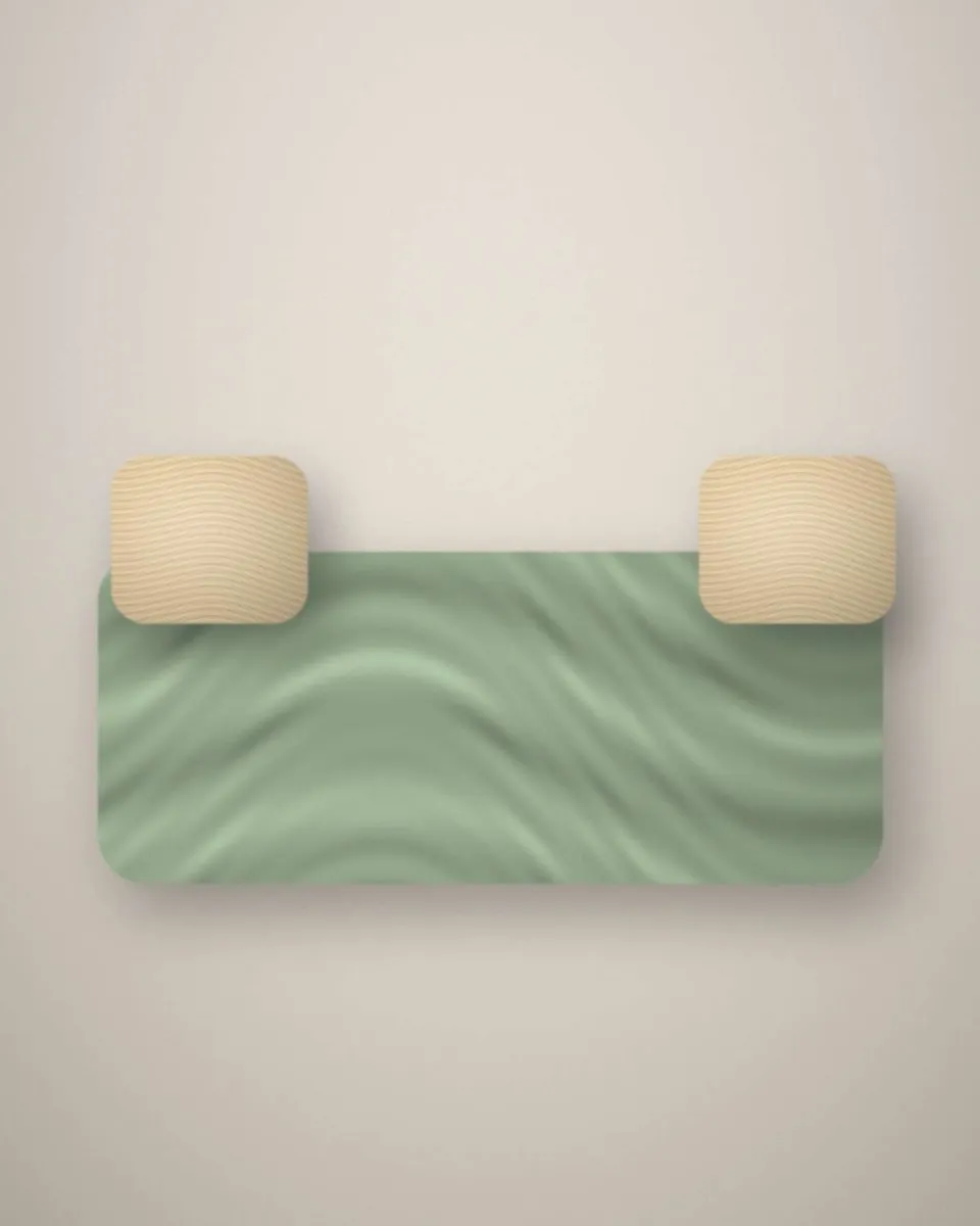 Banquette habillée d’une housse vert sauge avec coussins