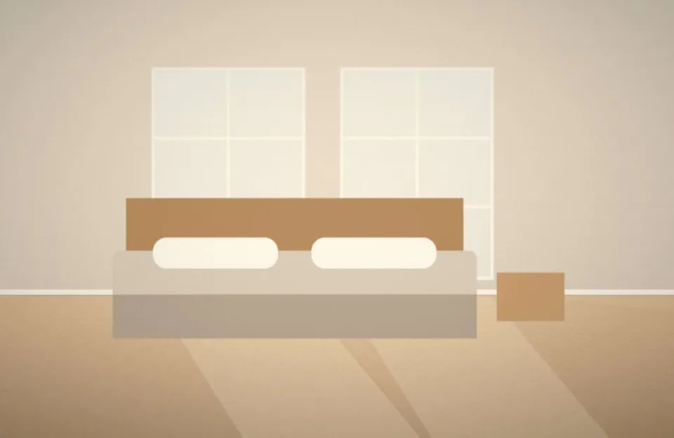 Chambre lumineuse avec draps en lin et parquet clair