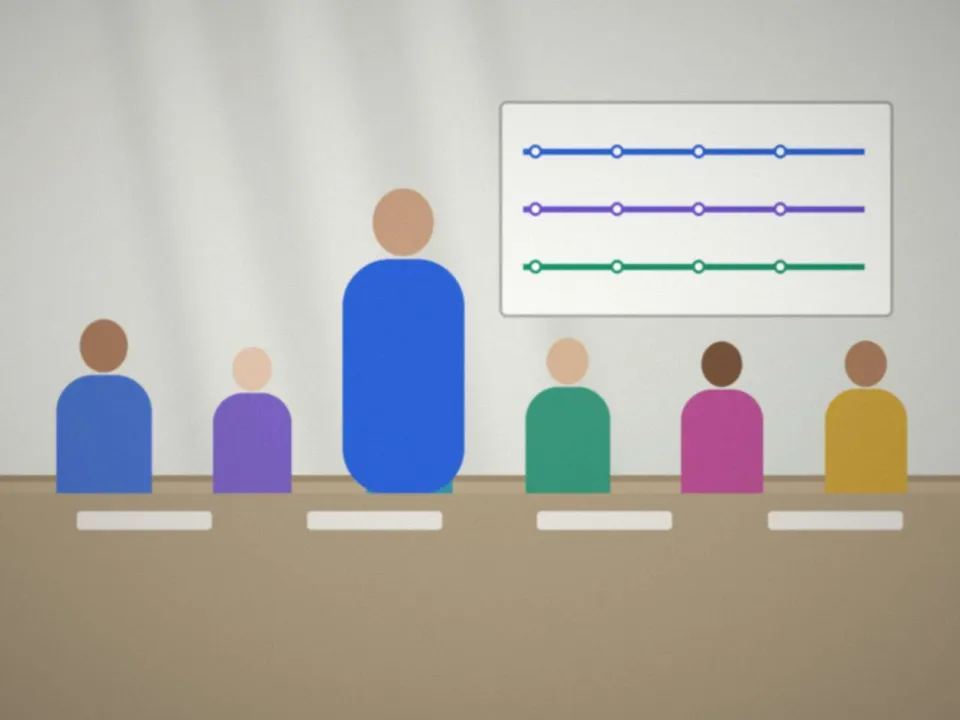 Salle de formation du centre : tables en îlots, grand écran et tableau blanc