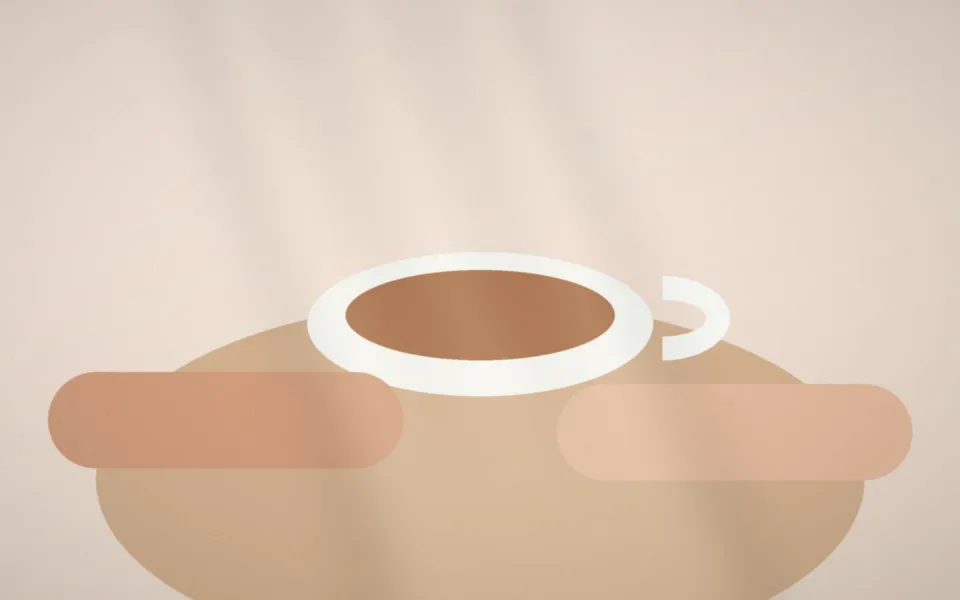 Tasse de thé et carnet de liaison posés sur une table